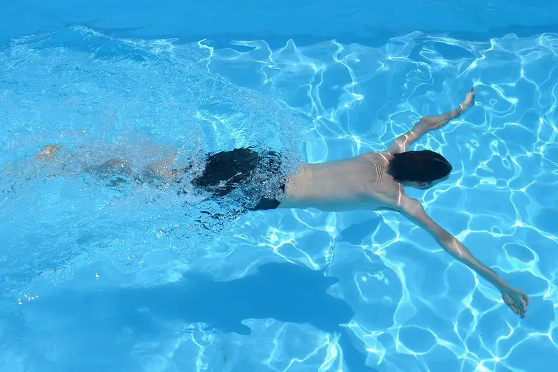 Kid Swimming in Pool