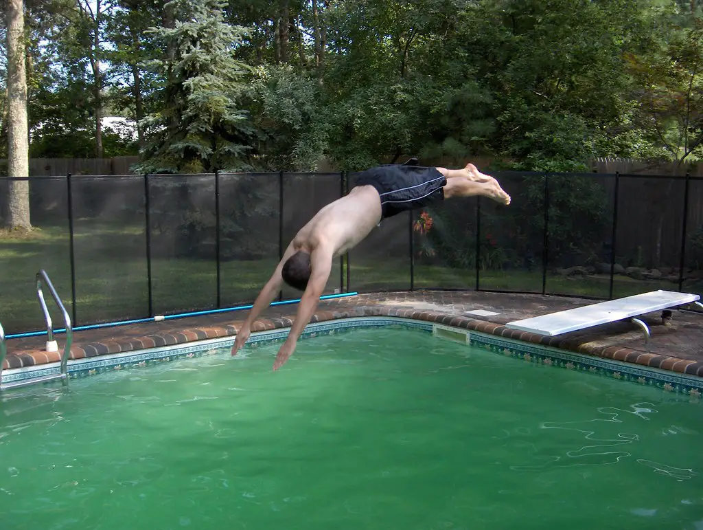 Green and Cloudy Swimming Pool Water